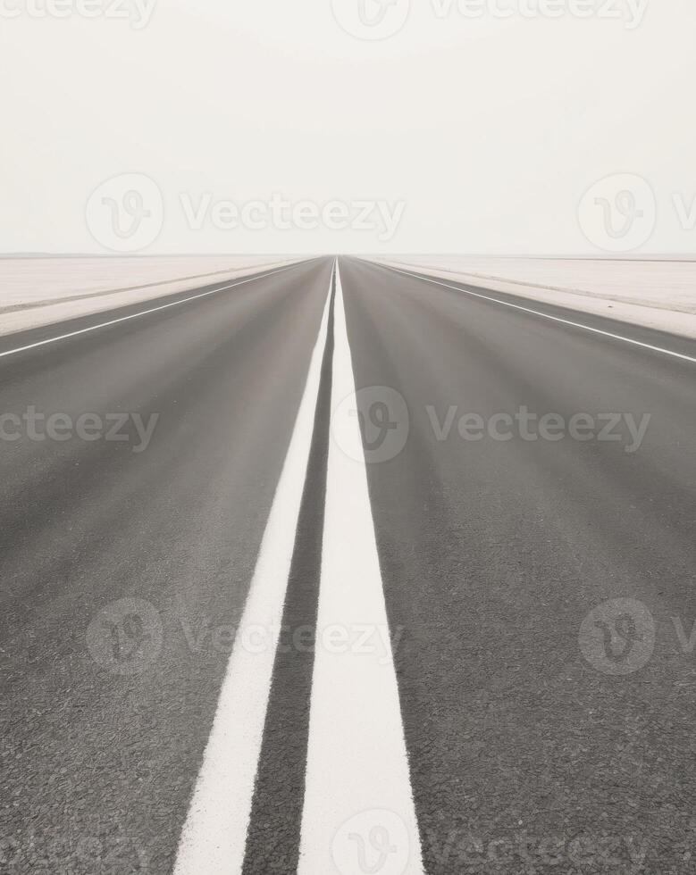 Empty road with white lines on the horizon photo