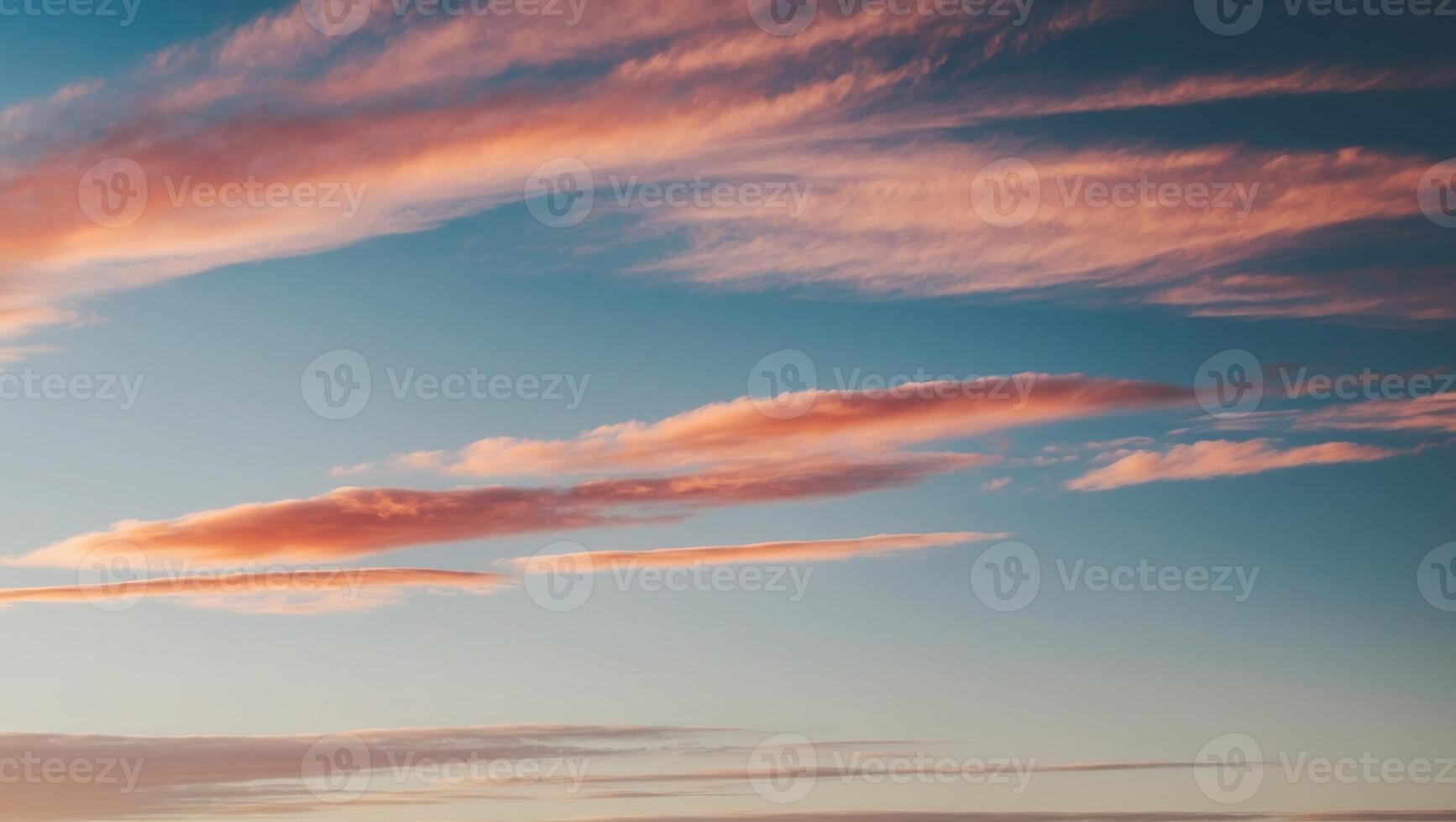 A sunset sky with clouds and pink and blue colors photo