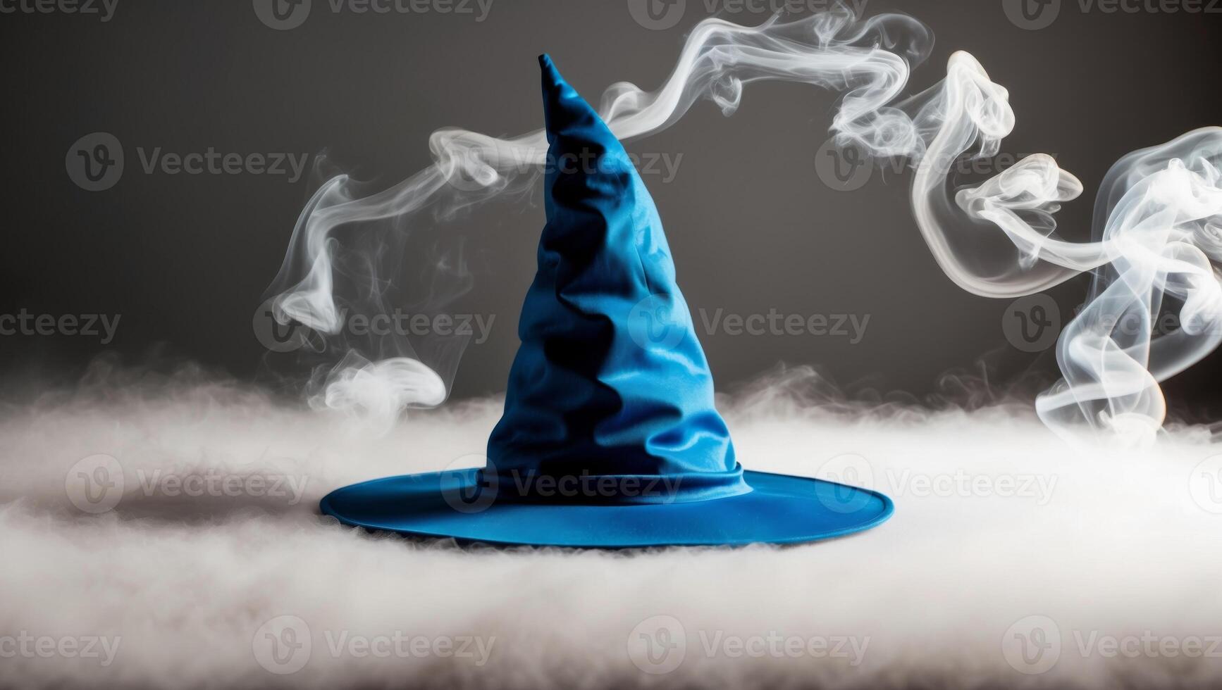 A blue witch hat is surrounded by smoke photo