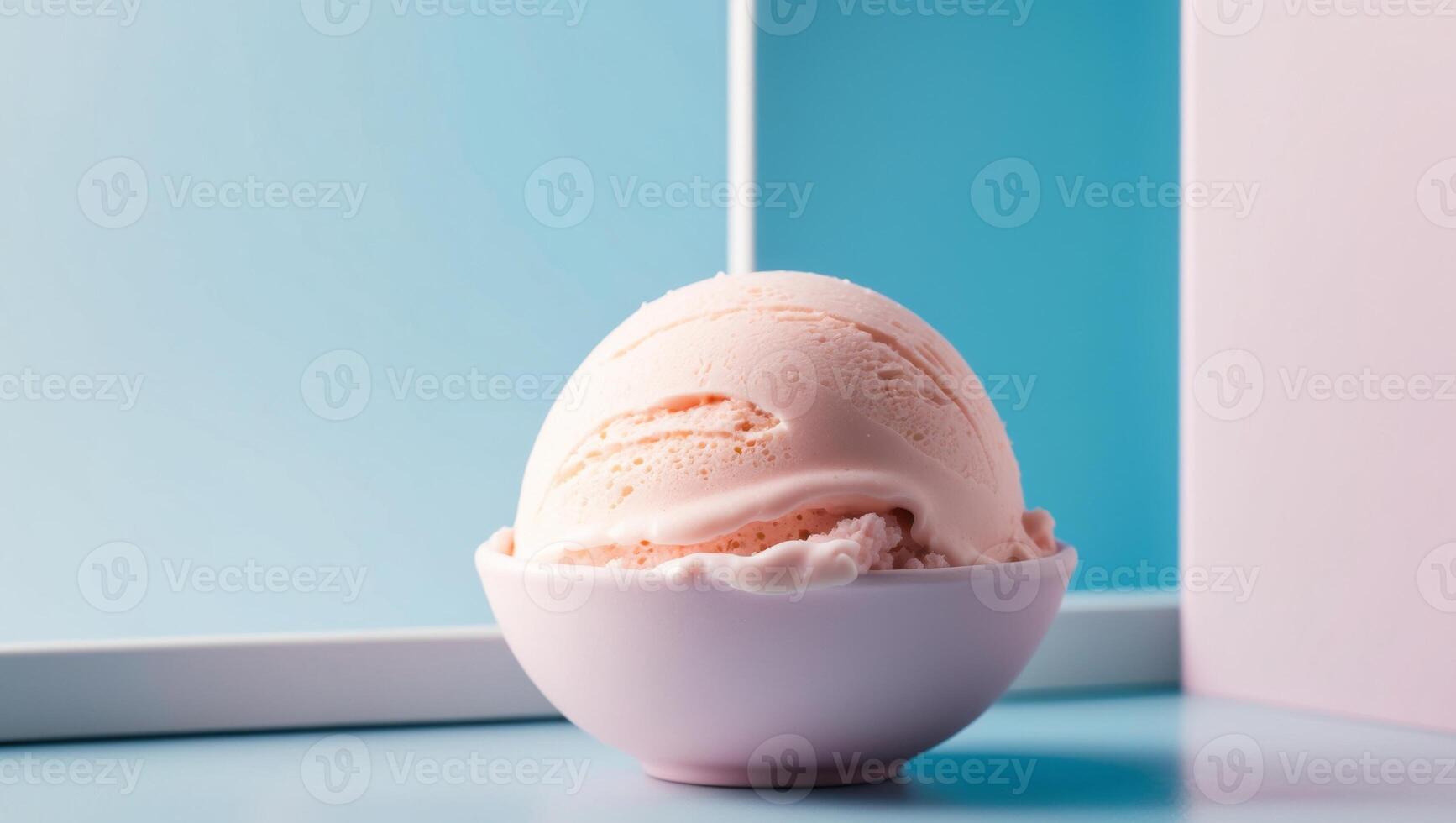 Frozen pink ice cream scoop on blue background. photo