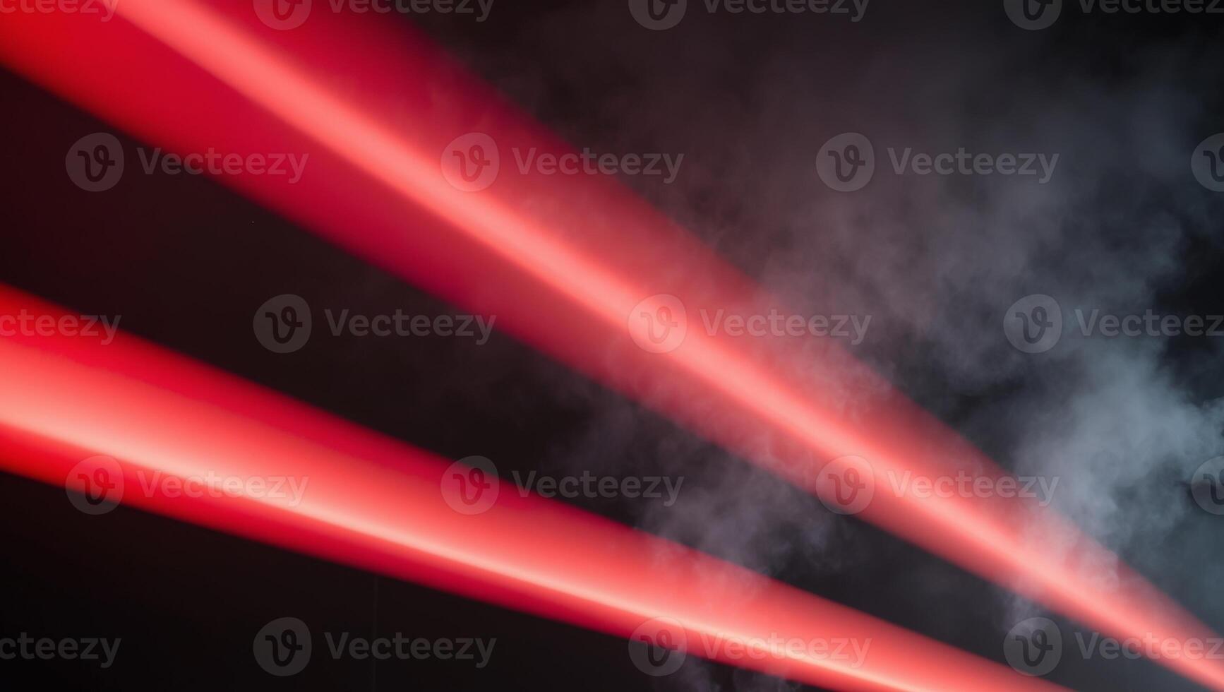 A red light beam is shown in the dark photo