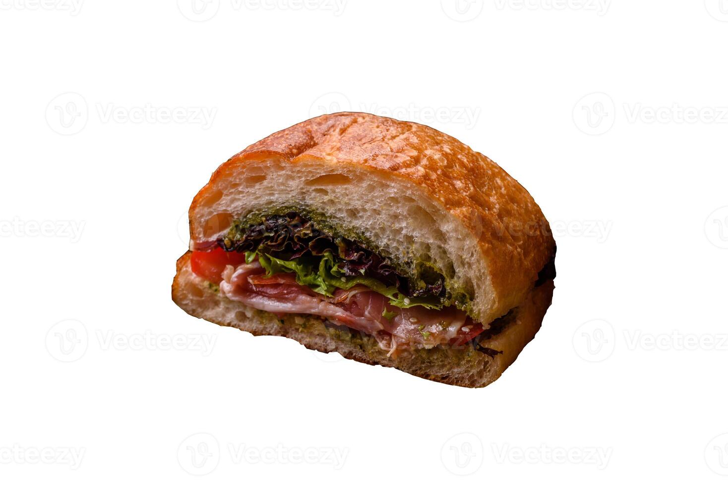 Ciabata with jamon or prosciutto, tomatoes, cheese and lettuce photo
