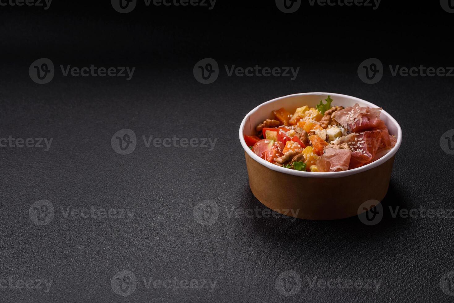 Appetizing salad with prosciutto, pumpkin, cheese and tomatoes photo