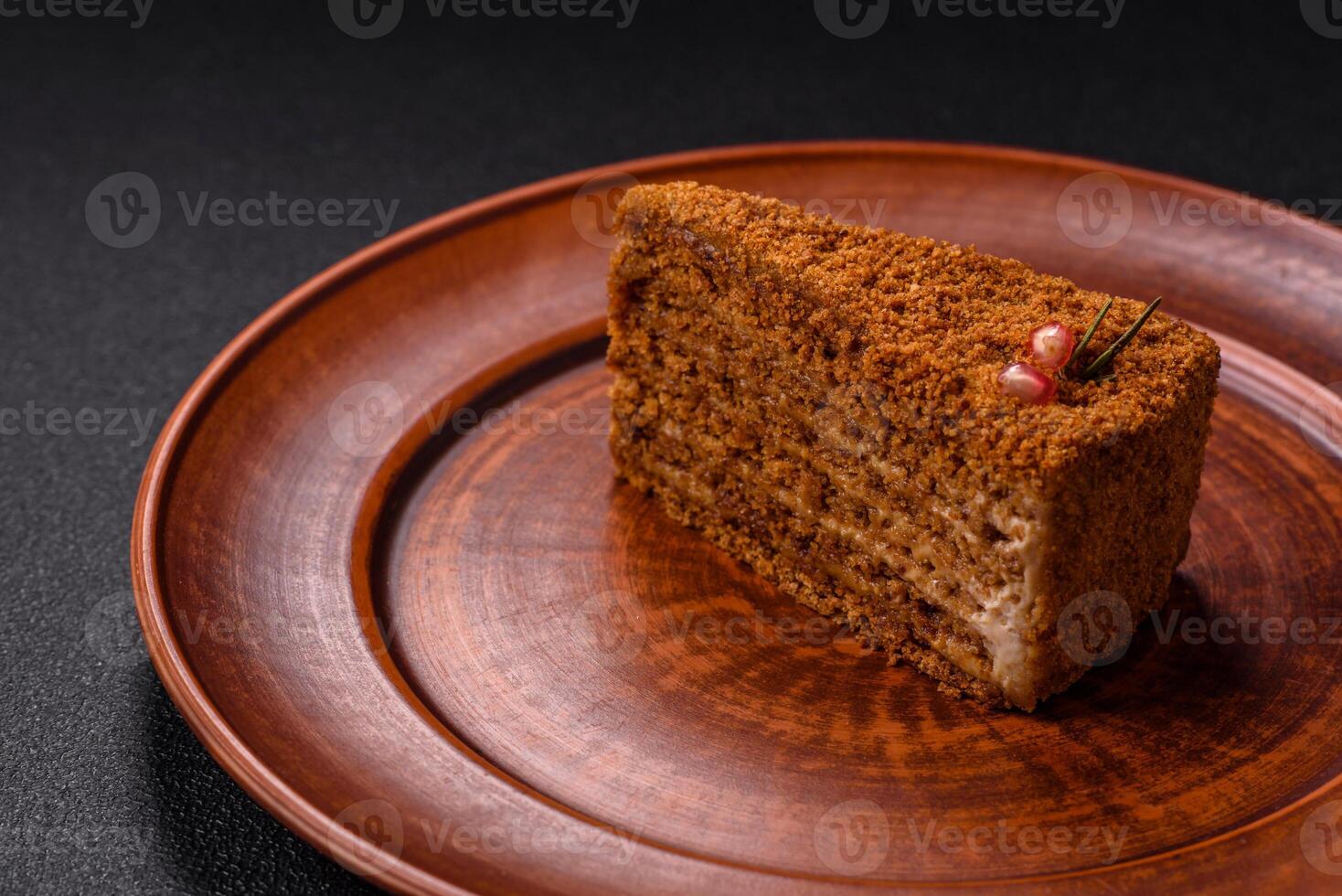 Piece of sweet layered honey cake photo