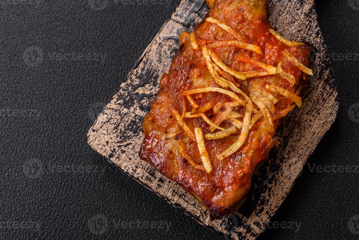 Pork or beef ribs with salt, spices and herbs baked on the grill photo