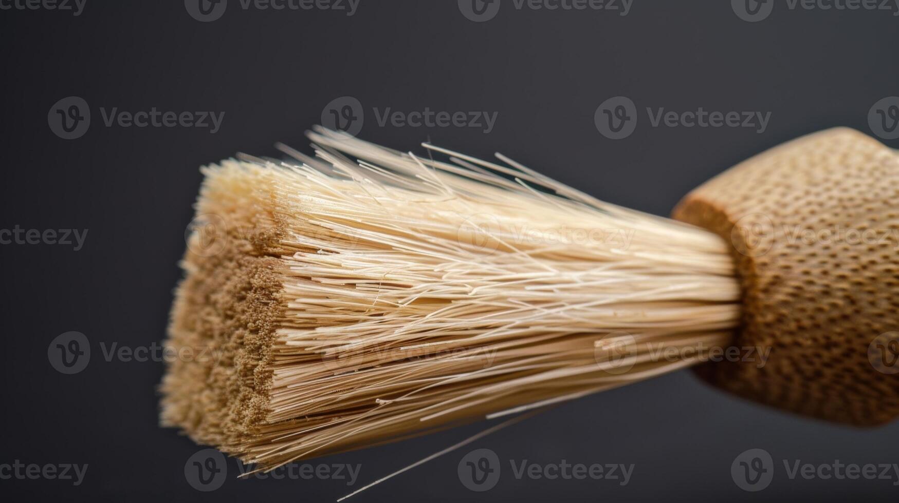 A macro shot of a bamboo pastry brush emphasizing the soft bristles and sy bamboo handle. The natural fibers of the bristles are clearly visible photo