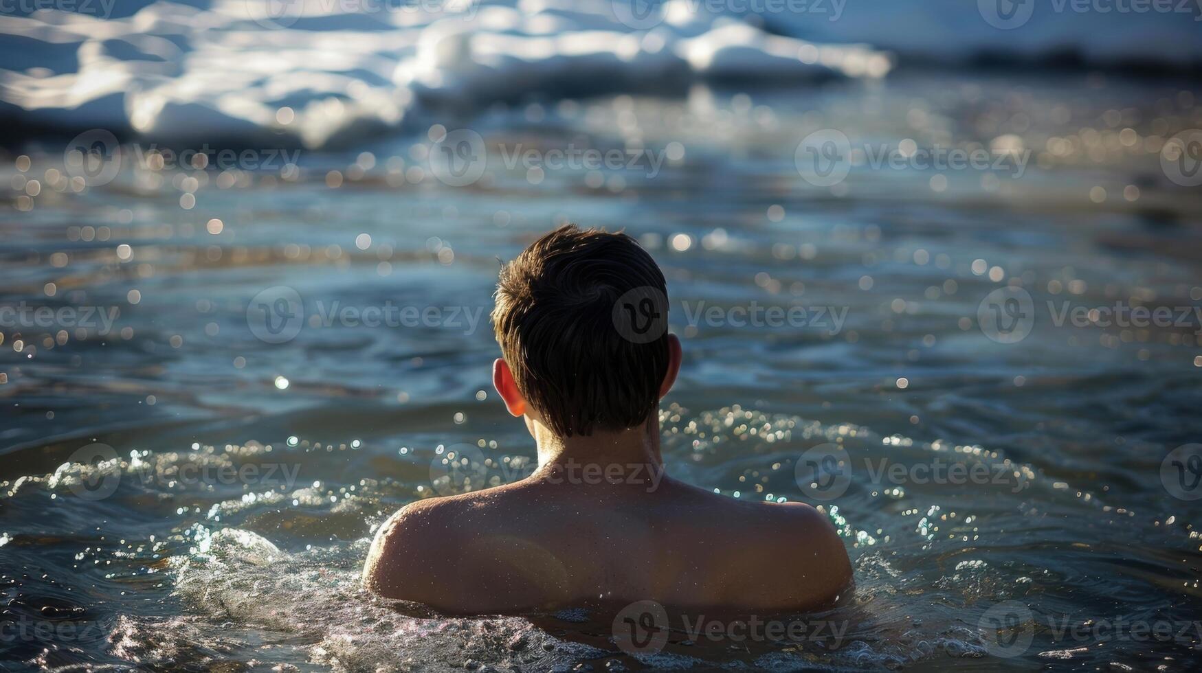 A person mentally preparing themselves before taking the plunge into the cold water photo