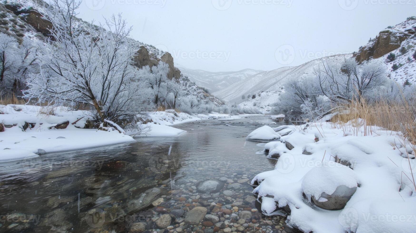 Nestled in a quiet valley a peaceful river runs through a snowy landscape providing a tranquil setting for a solo ice bath experience photo