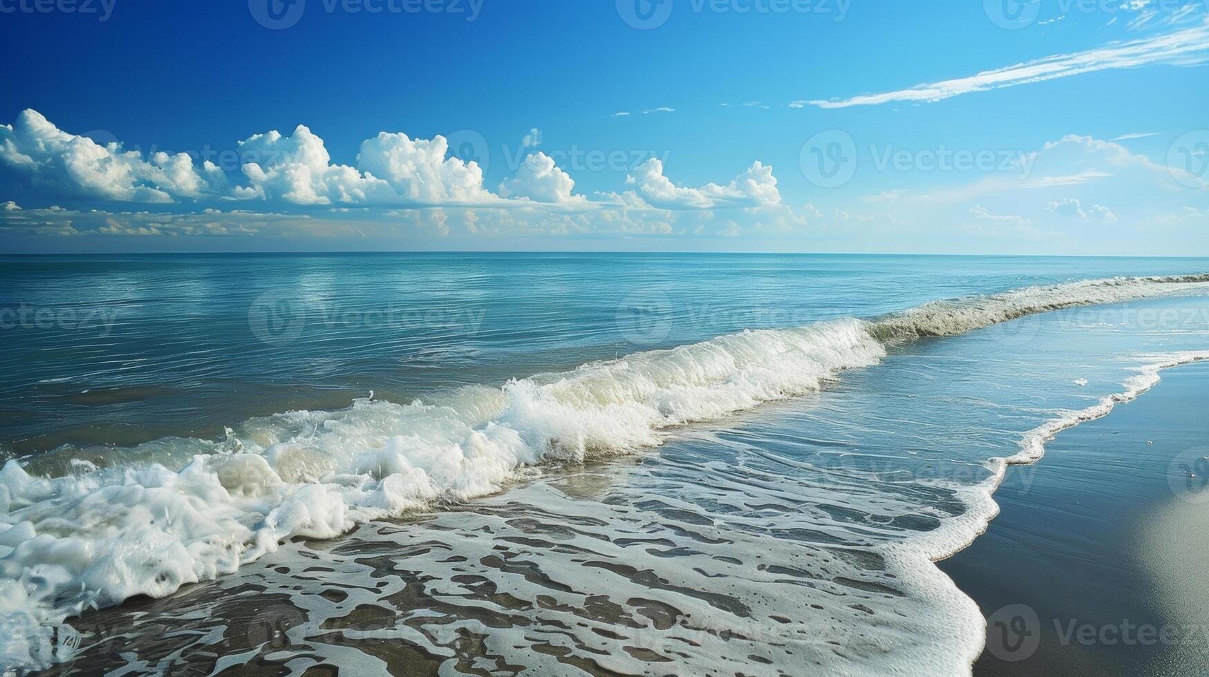 A serene beach with gentle waves breaking against the shore as individuals submerge themselves in the frigid ocean waters as part of a cleansing tradition photo
