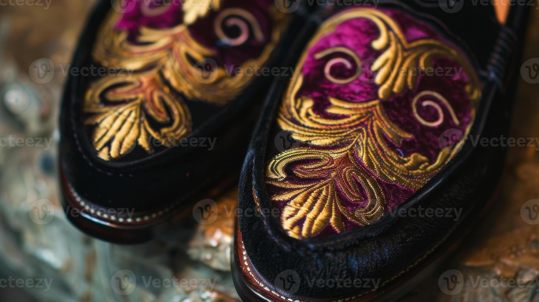 A pair of handmade suede loafers featuring a unique handpainted pattern in shades of deep burgundy and gold photo