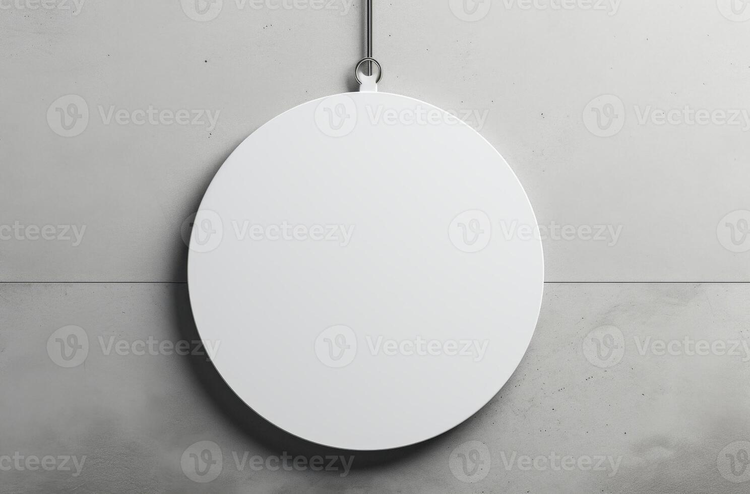 Blank Round Sign Hanging on Gray Wall photo