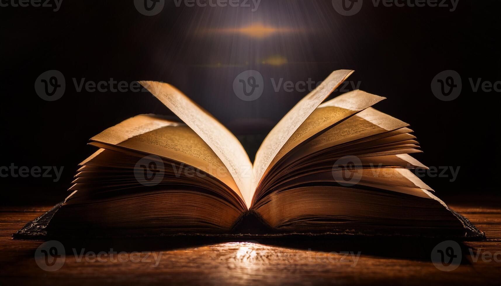 An open book with illuminated pages in a dark setting, highlighted by a mystical glow, creating a dramatic and captivating effect. photo