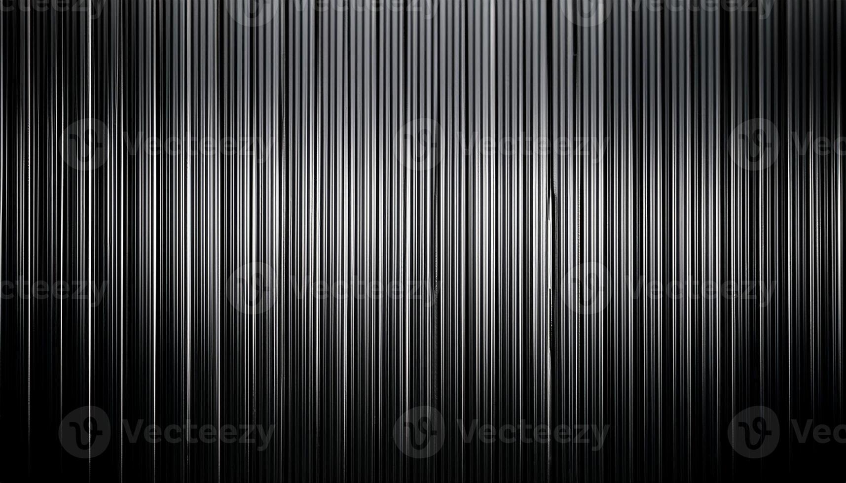 Close-up of a metallic corrugated sheet featuring vertical lines and a gradient effect, creating a sleek industrial pattern. photo