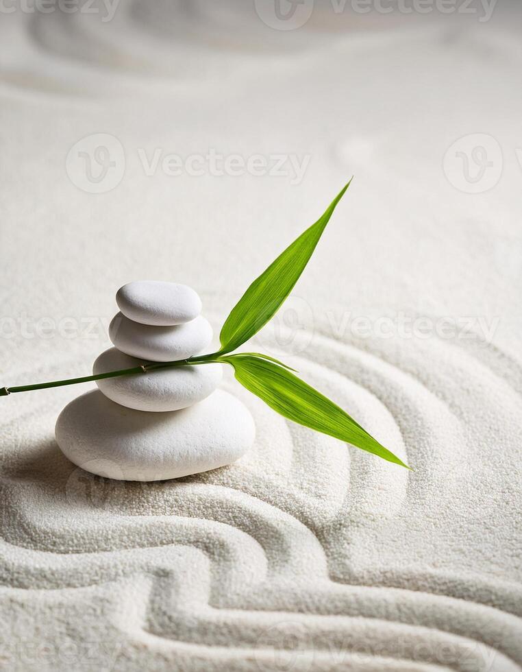 Serene arrangement of smooth white stones and a green leaf on raked sand, symbolizing balance and tranquility in a zen garden. photo