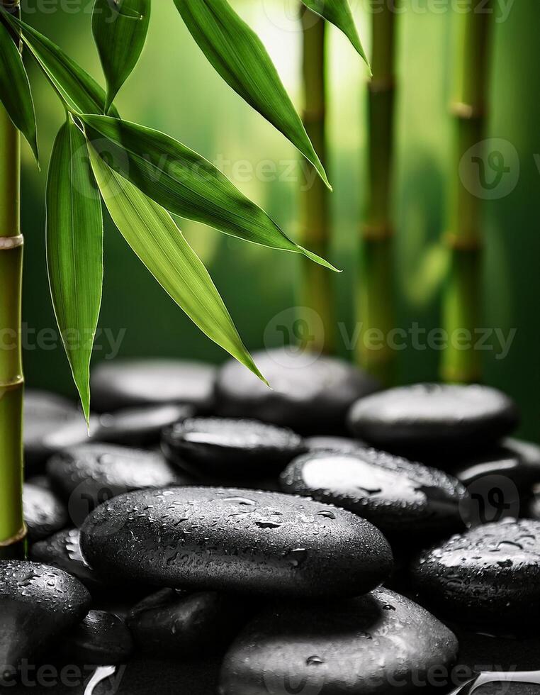 Smooth black spa stones covered in water droplets, surrounded by fresh green bamboo leaves, creating a serene and refreshing ambiance. photo