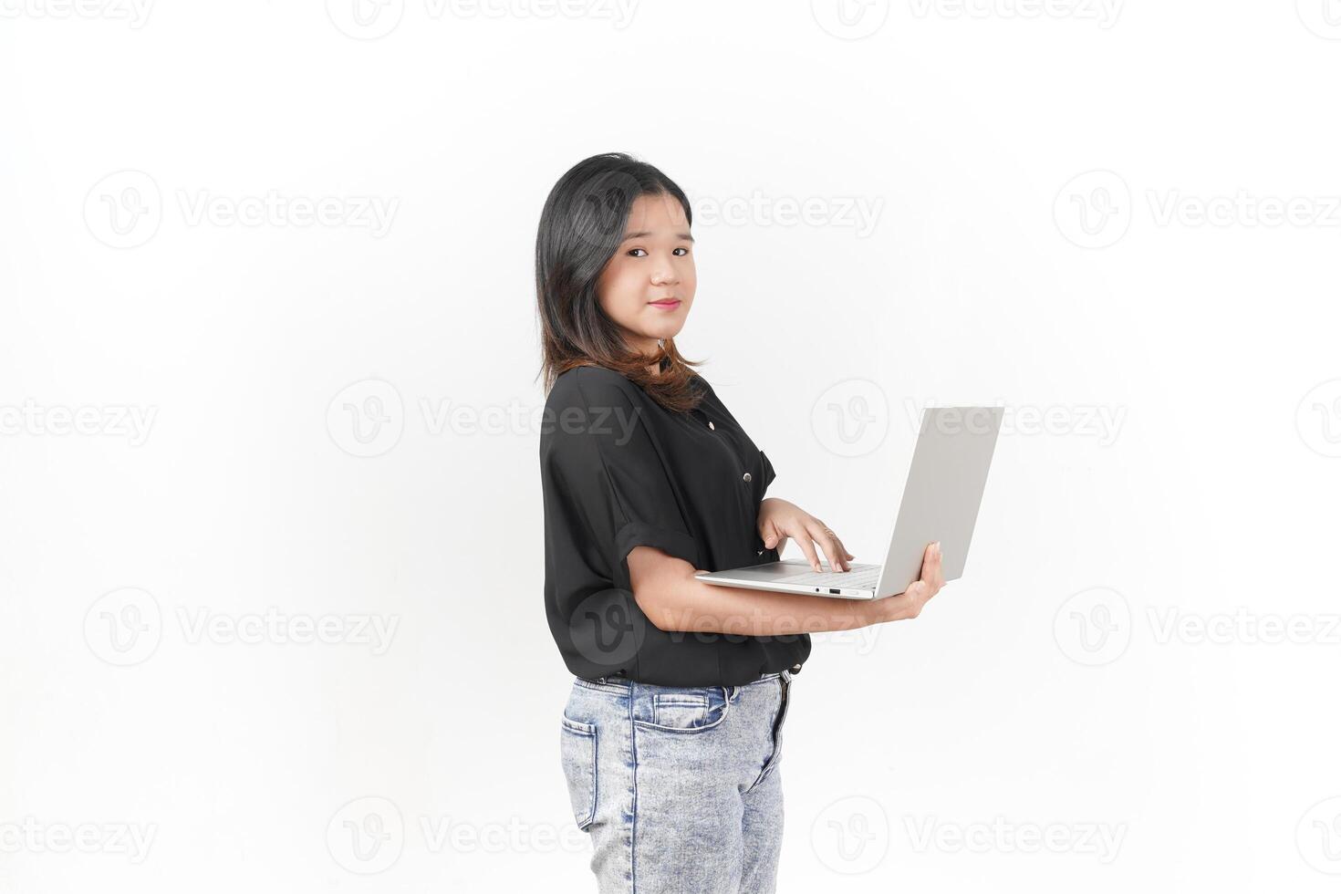 happy asian woman wearing black shirt holding laptop computer on isolated background photo