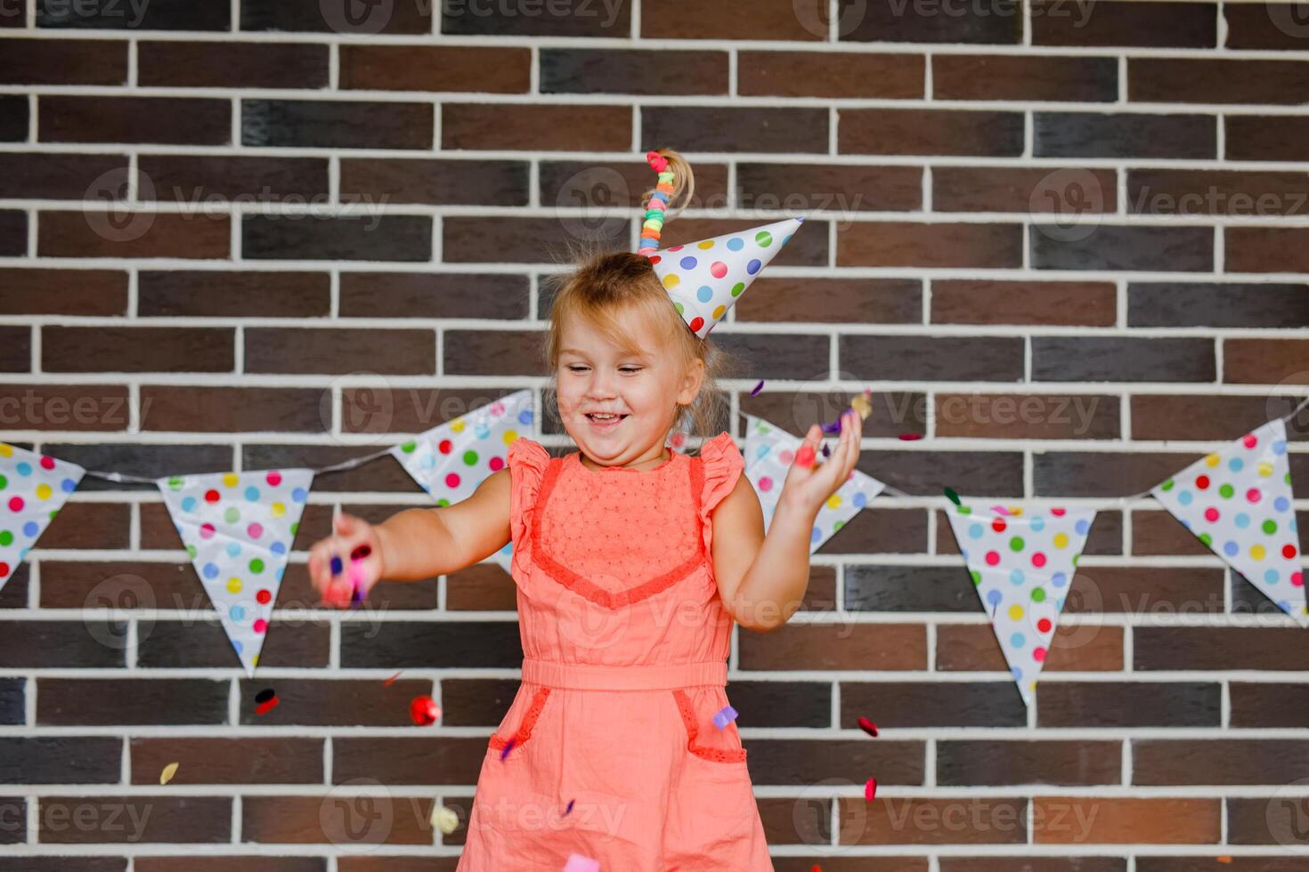 Cute preschooler girl makes art at a summer outdoor party photo