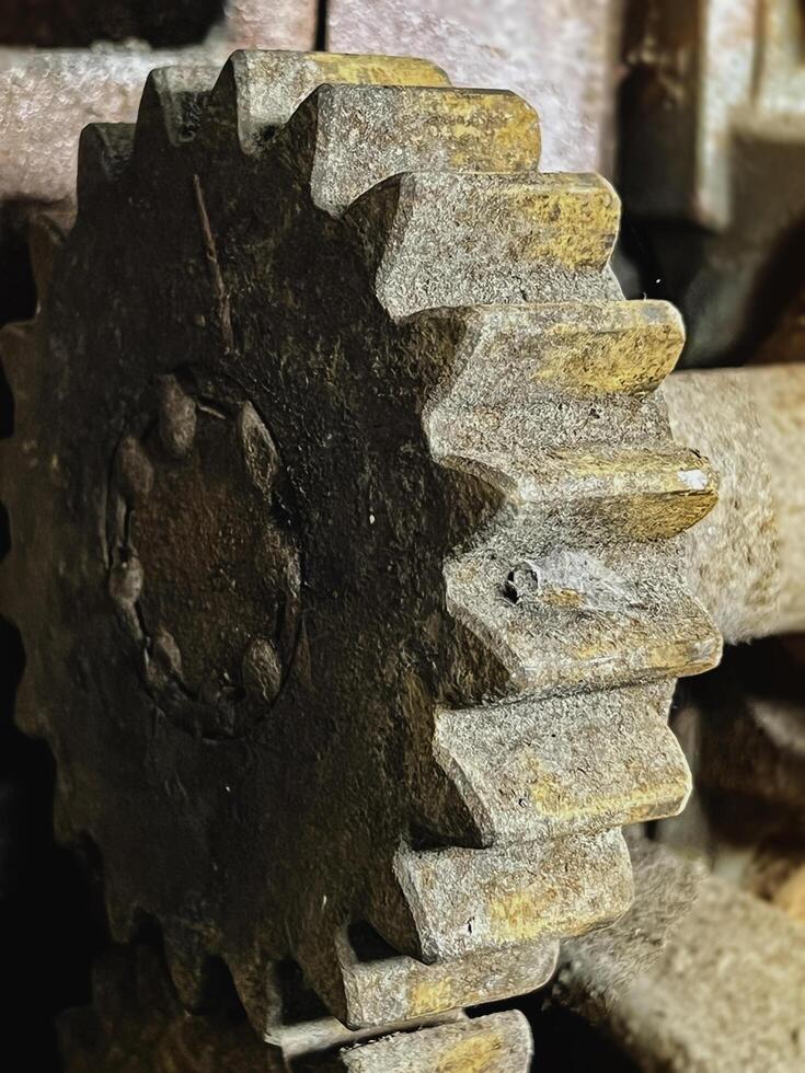 Aged Cogwheel part of old machine in factory, photo