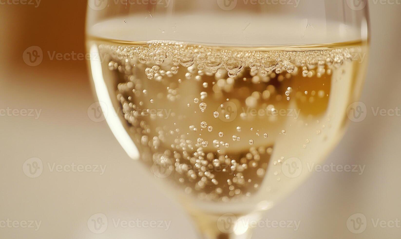 A glass of champagne with bubbles in it photo