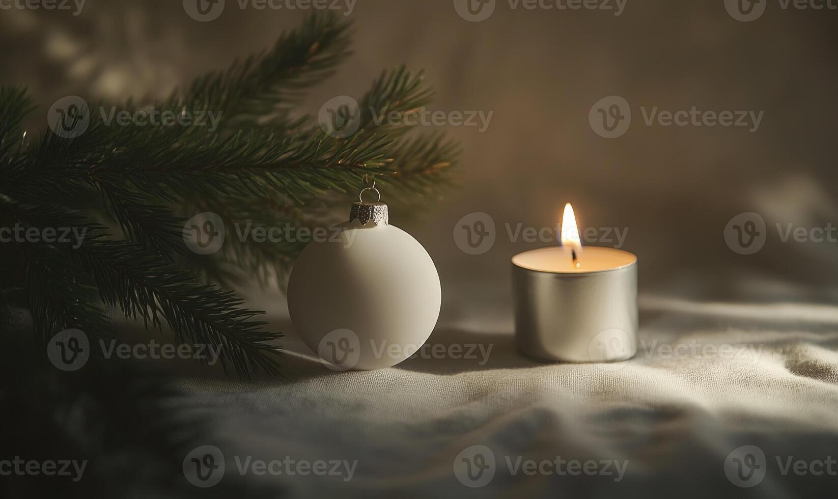 A white ornament and a candle are on a table photo