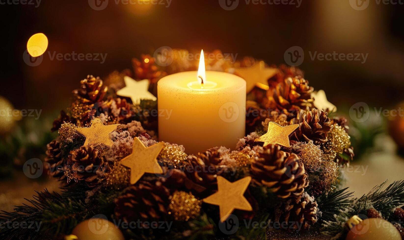 A candle is lit in a wreath of pinecones photo