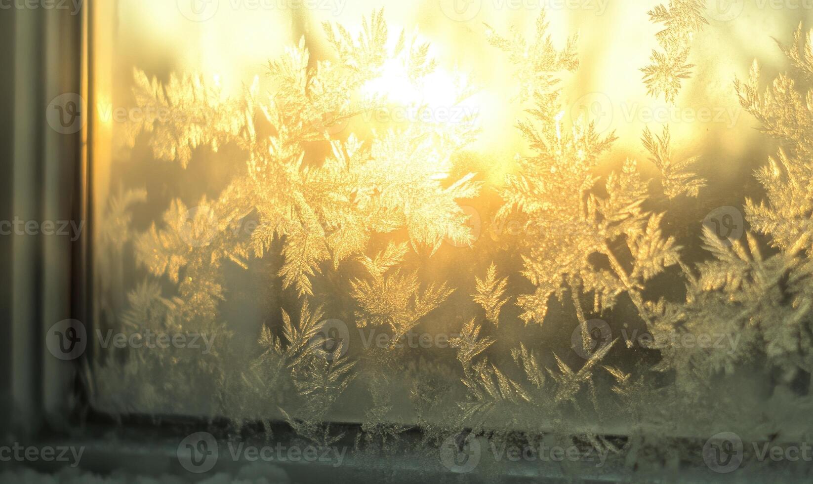 The window is frosted and the sun is shining through it photo