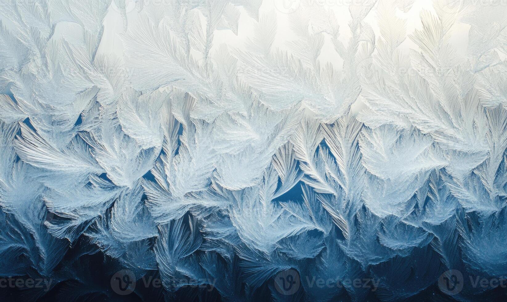 The image is a close up of a frosty window with a blue and white pattern photo