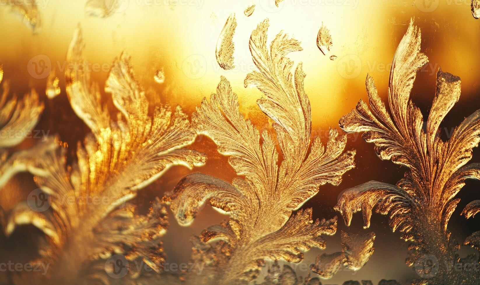 A frosty window with a golden leafy design photo
