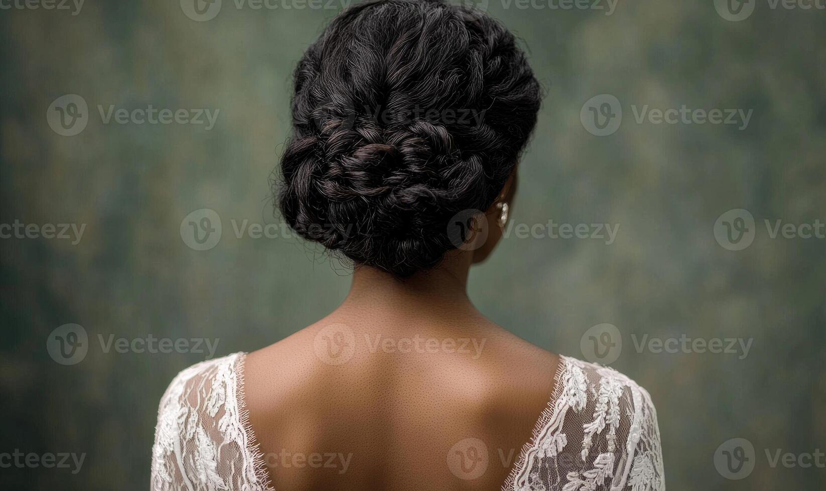 A woman with a braided hairstyle and a lace top photo