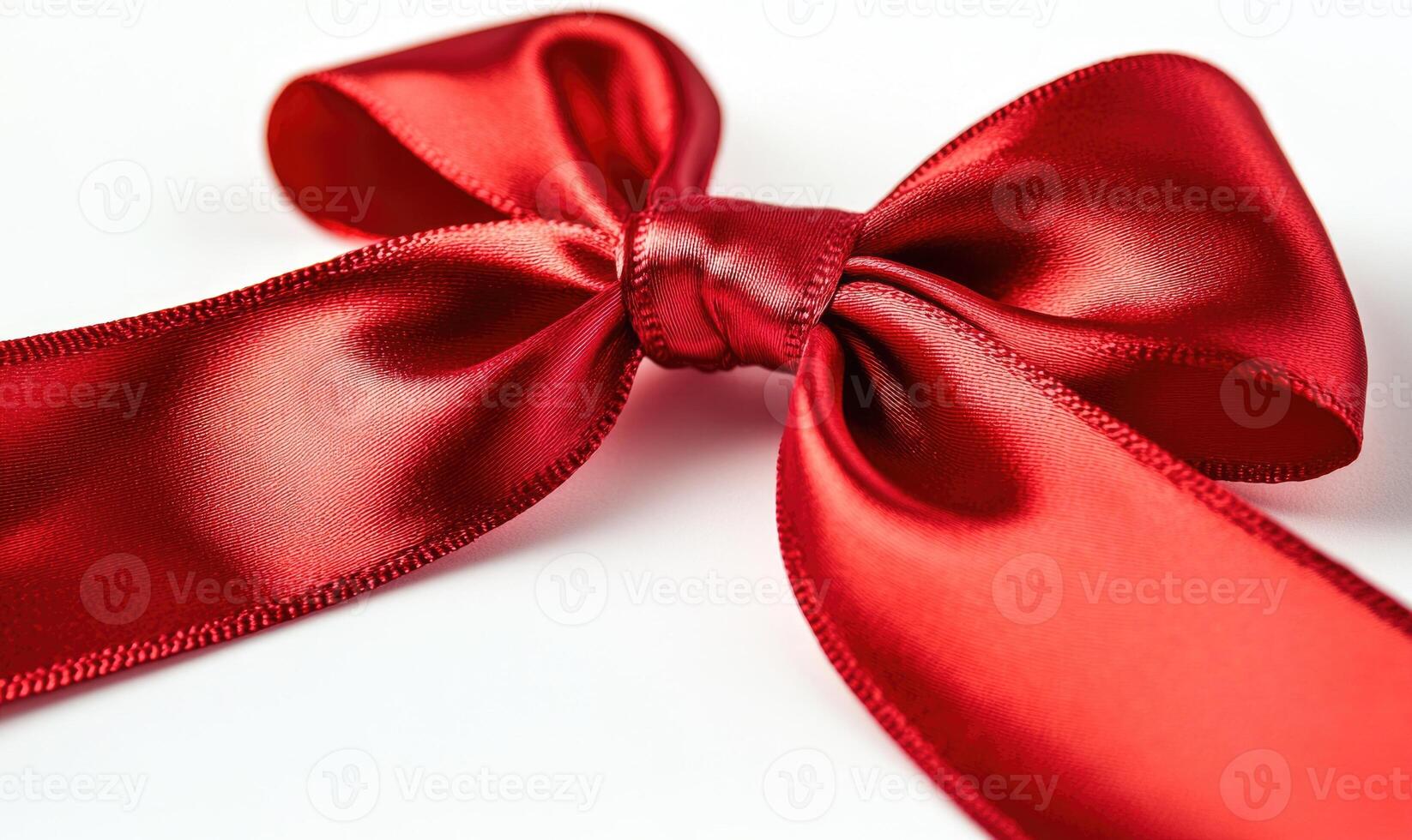A red ribbon is tied in a bow photo