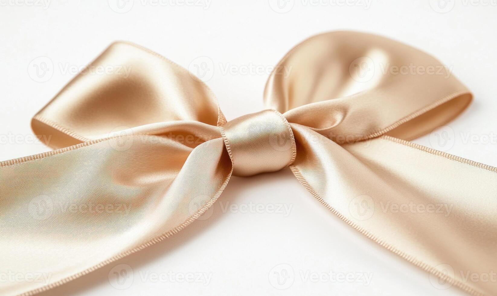 A gold ribbon is tied in a bow photo