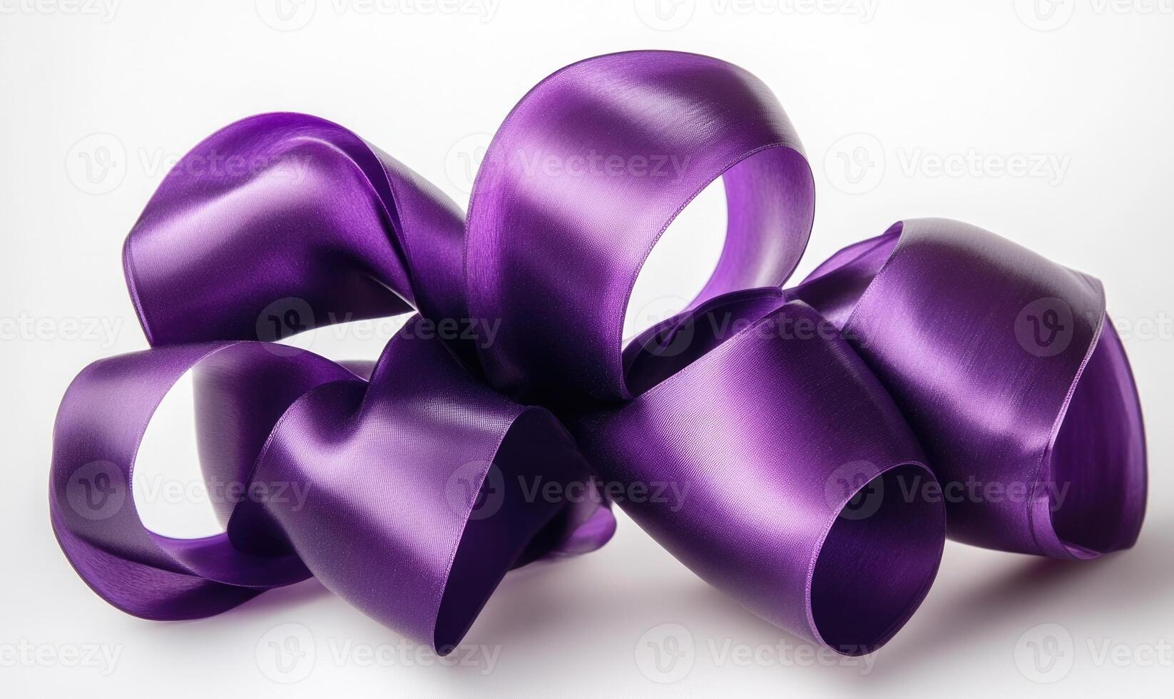A purple ribbon is curled up and twisted photo