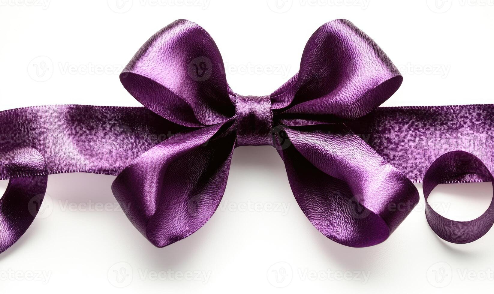 A purple ribbon with a bow is shown photo
