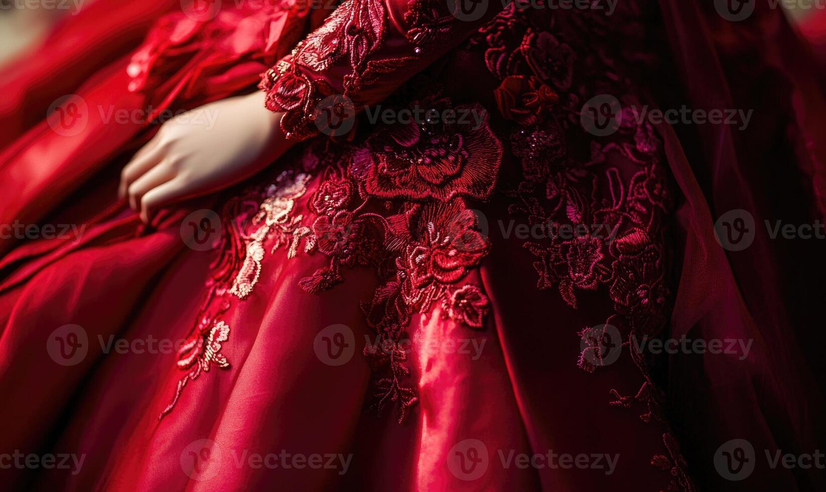 A woman is wearing a red dress with flowers on it photo