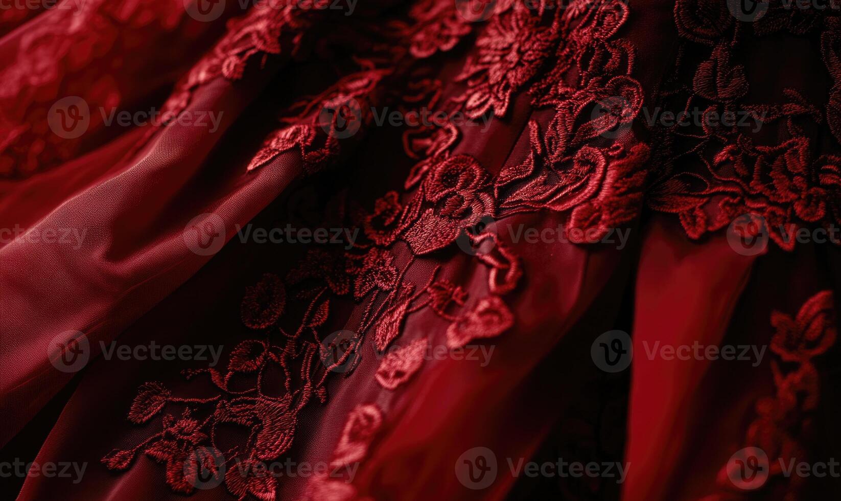 A red dress with a floral pattern is shown in close up photo