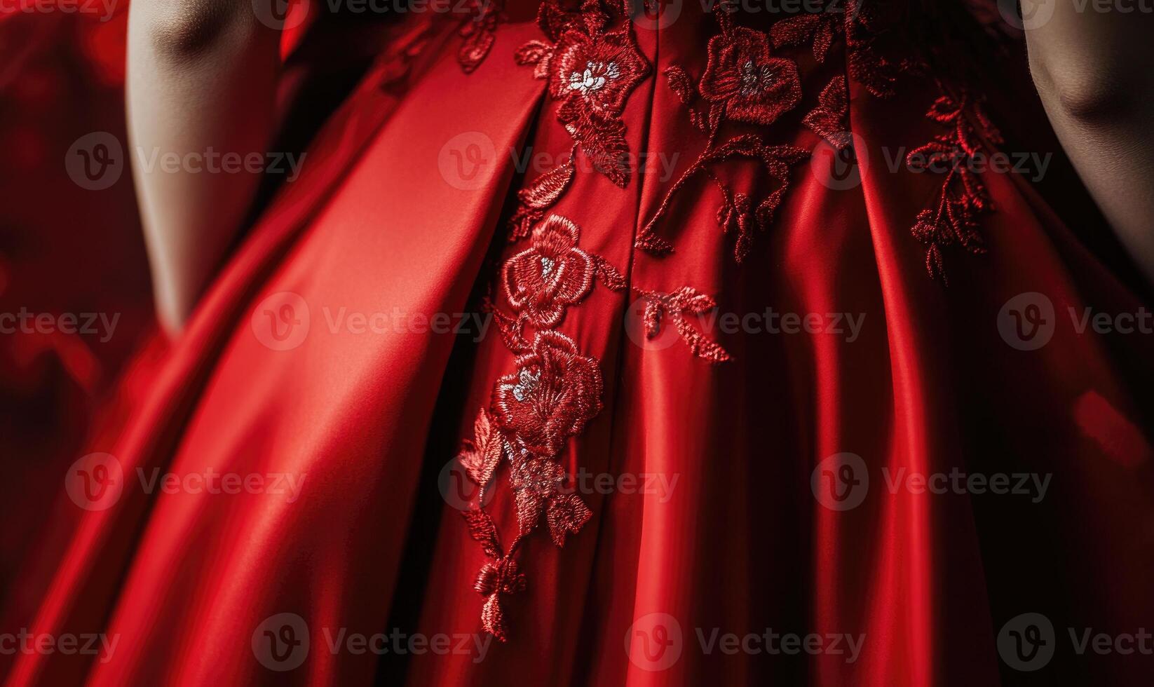 A woman is wearing a red dress with flowers embroidered on it photo