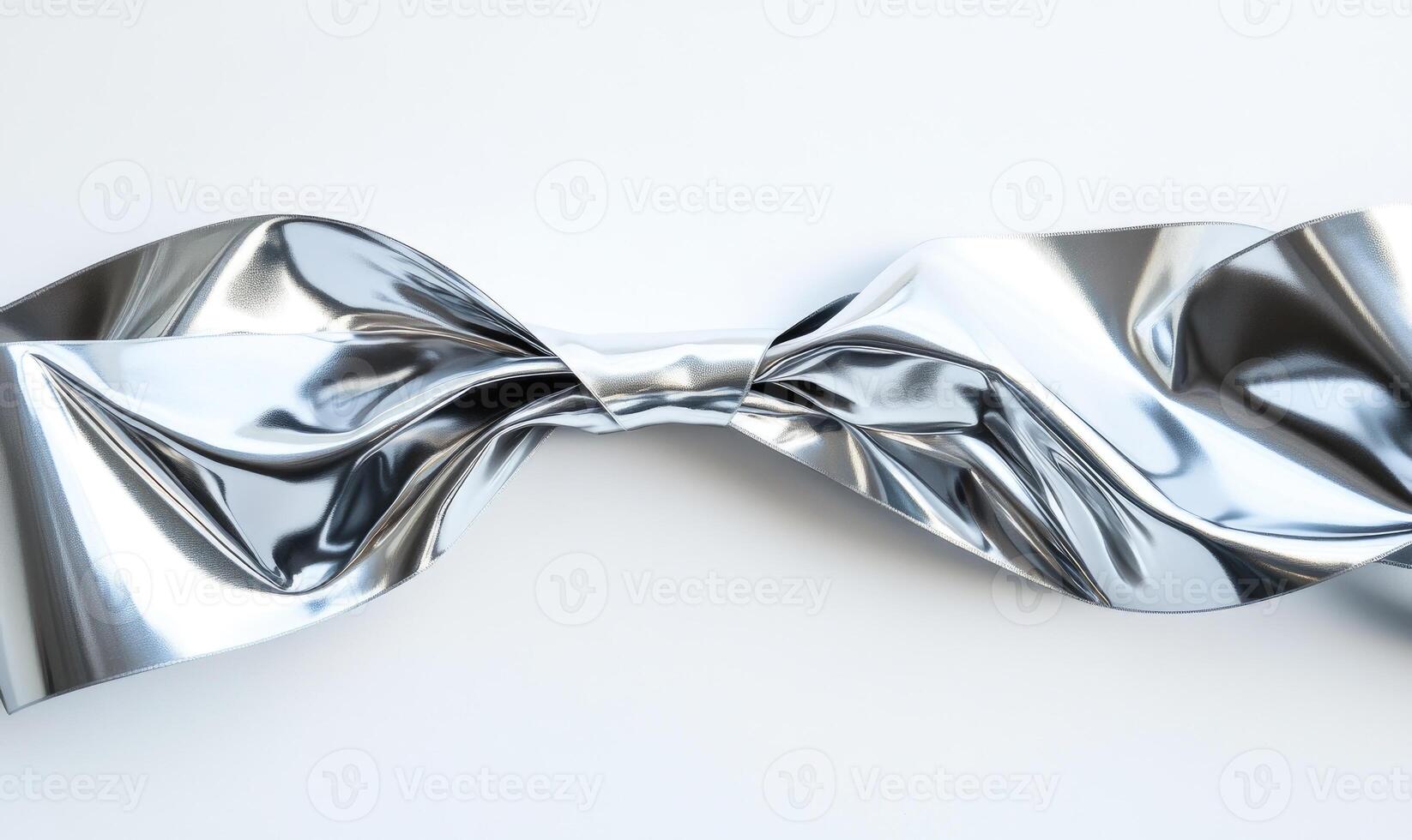 A silver ribbon is curled up and twisted photo