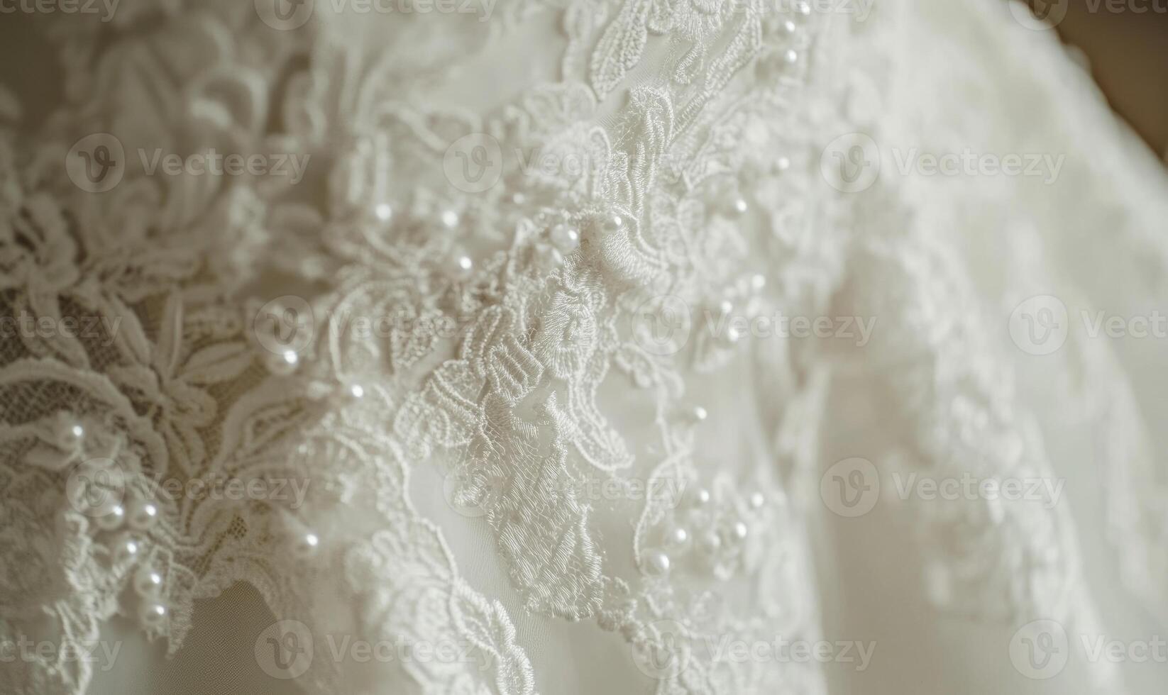 Close up of a wedding dress with lace photo