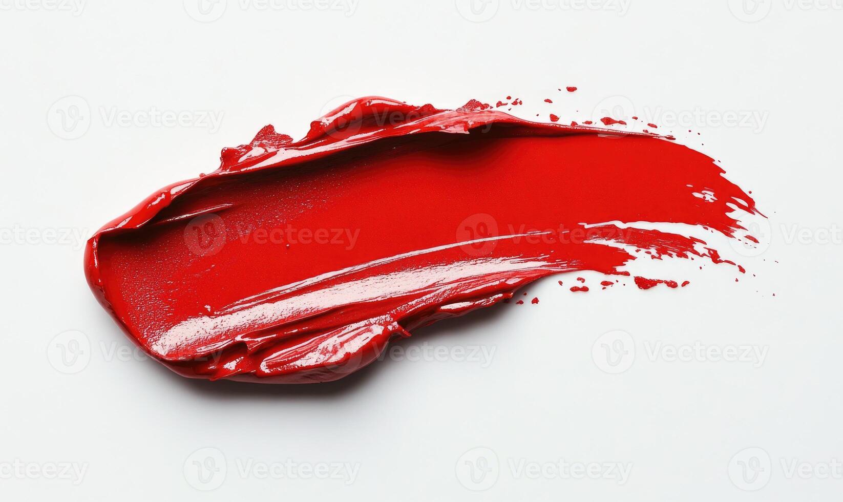A red lipstick brush stroke on a white background photo