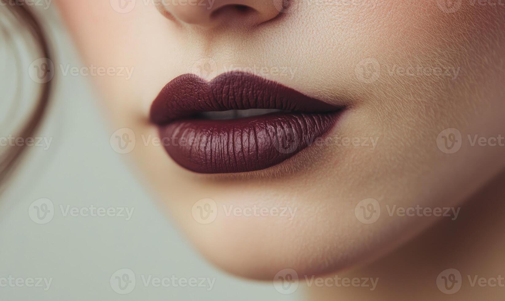 A woman with a red lip is smiling photo