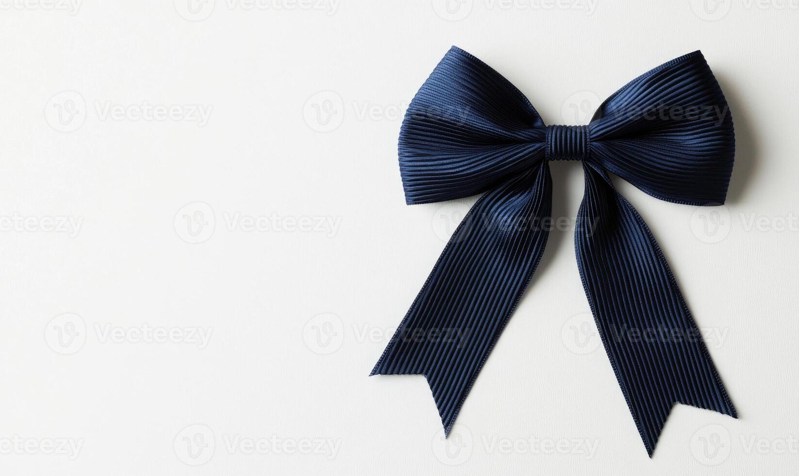 A blue ribbon bow is on a white background photo