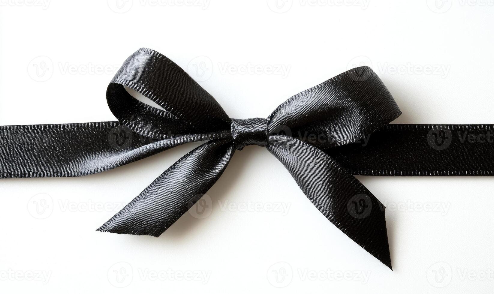 A black ribbon with a bow is shown on a white background photo