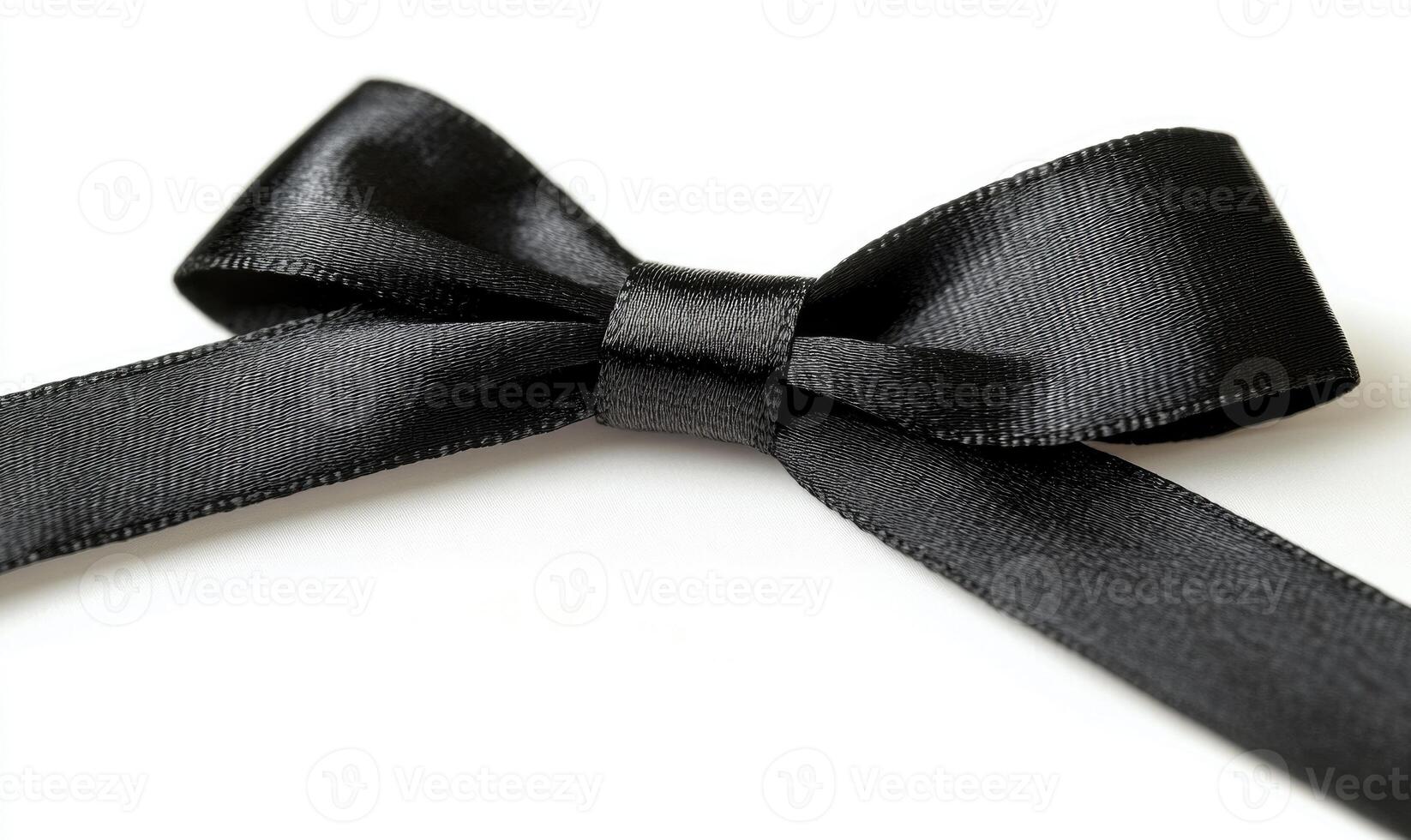 A black ribbon is tied into a bow photo