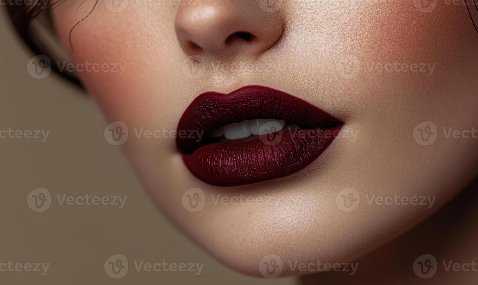 A woman with a red lip is smiling photo