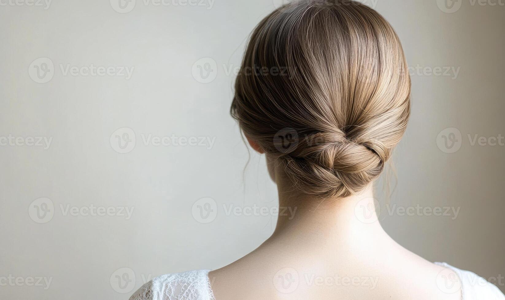 A woman with a bun in her hair photo