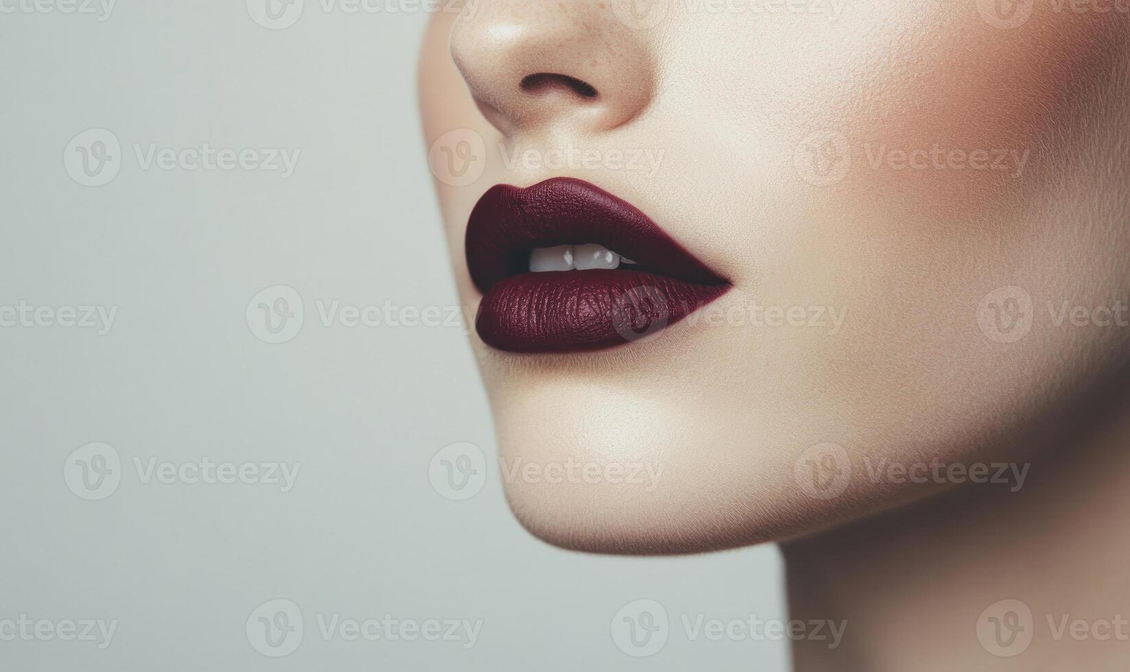 A woman with a red lip is shown in a close up photo
