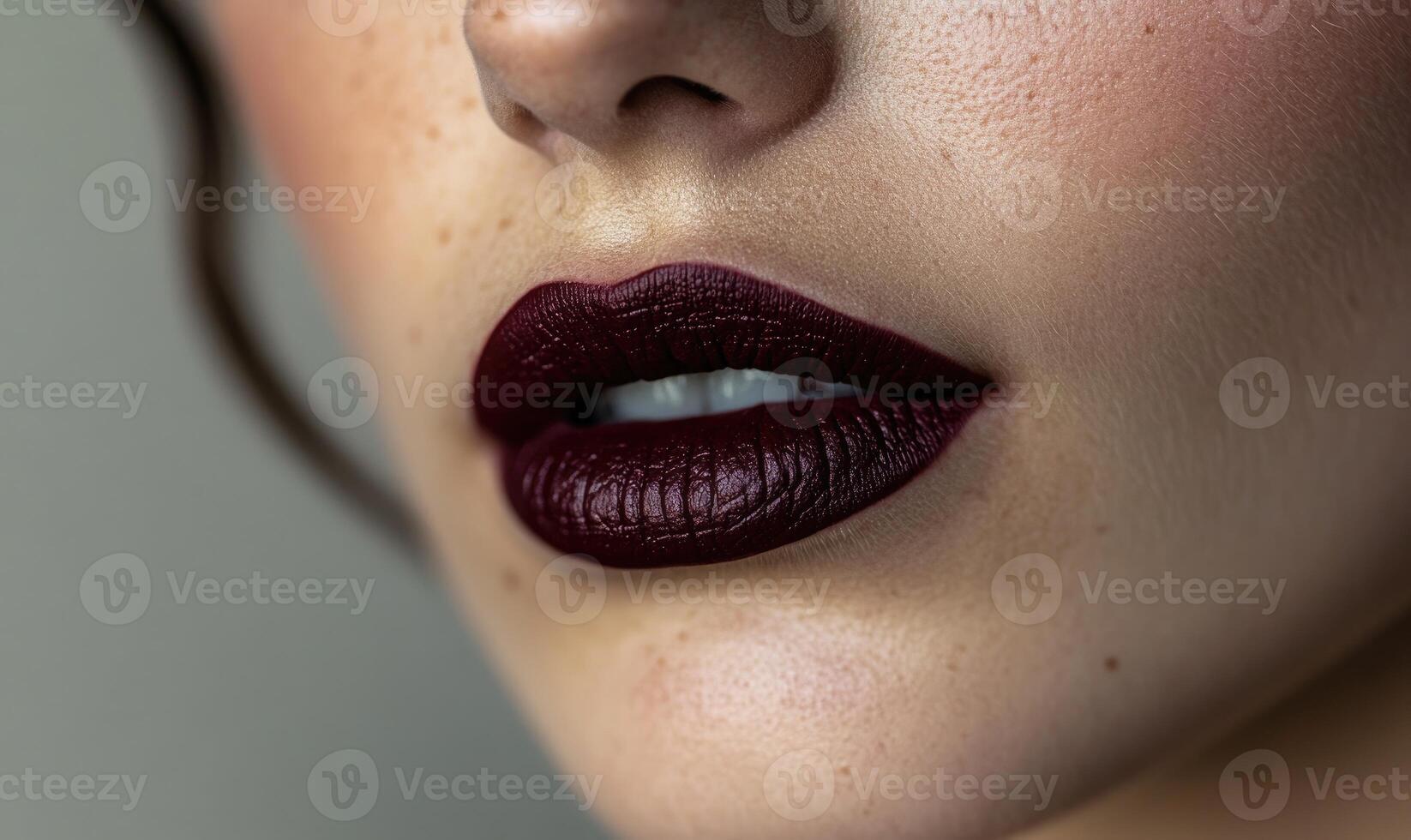 A woman with a red lip is smiling photo