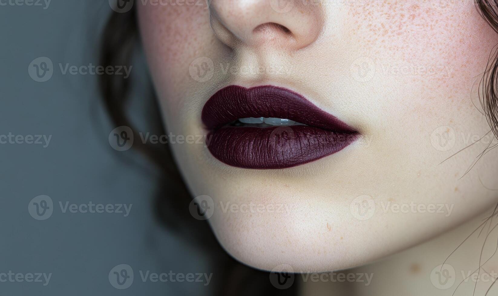 A woman with red hair and a purple lip photo