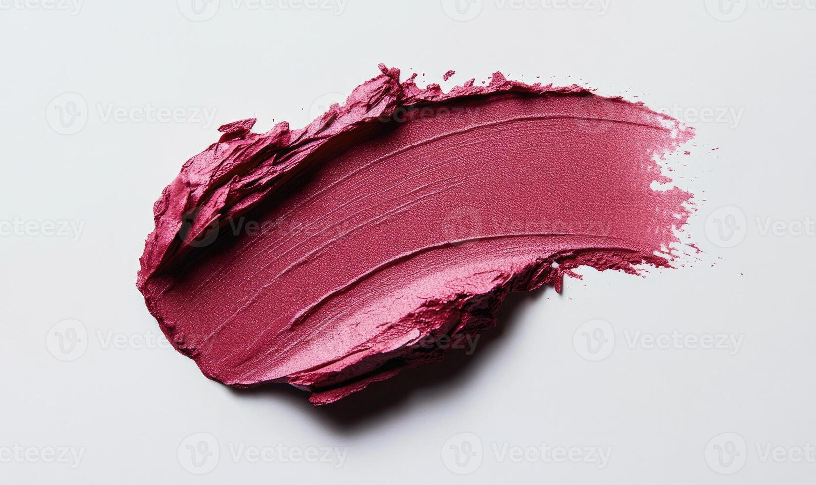 A close up of a pink lip gloss photo