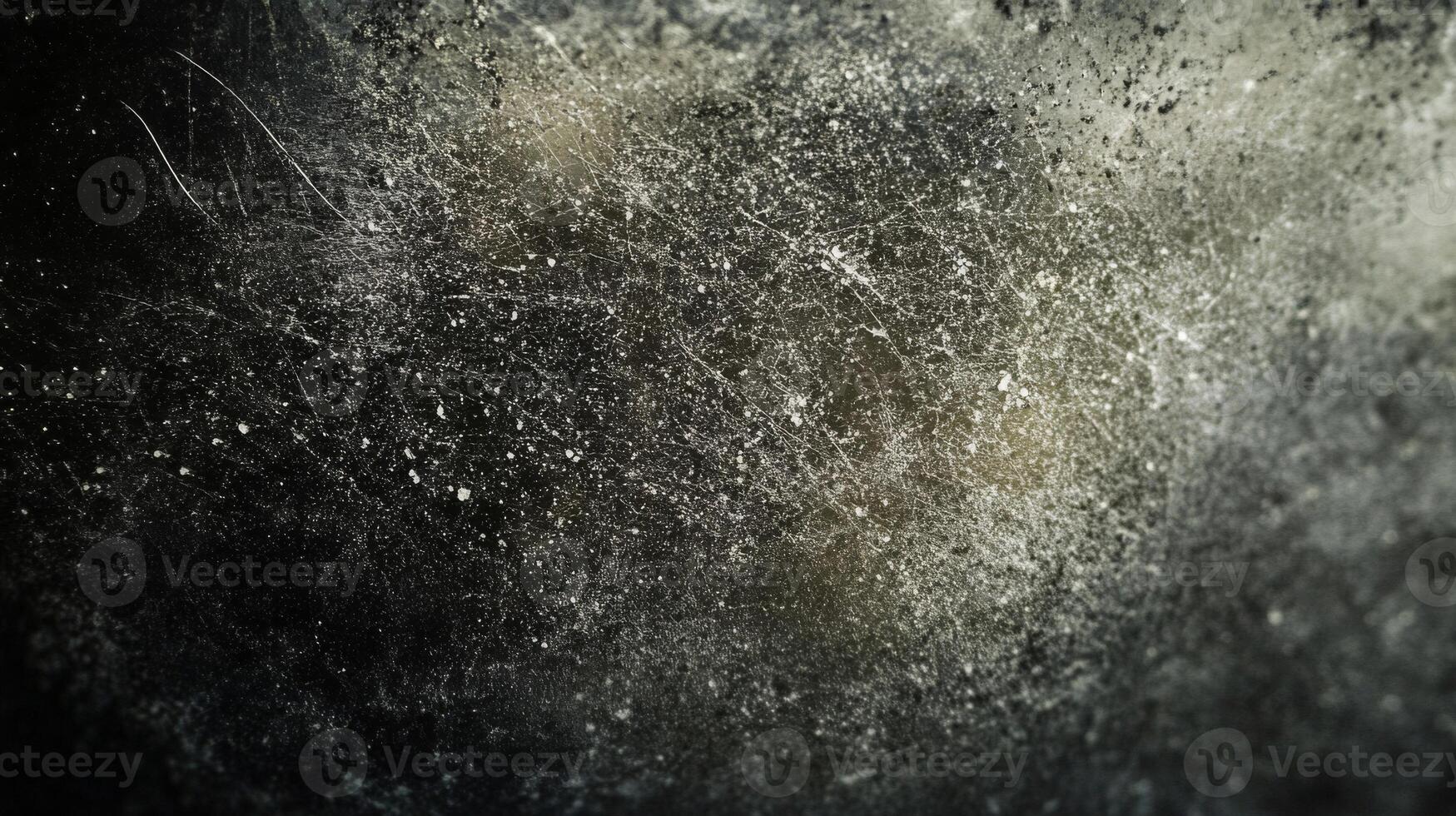 Close-up of a Dark Surface with White Scratches and Spots photo